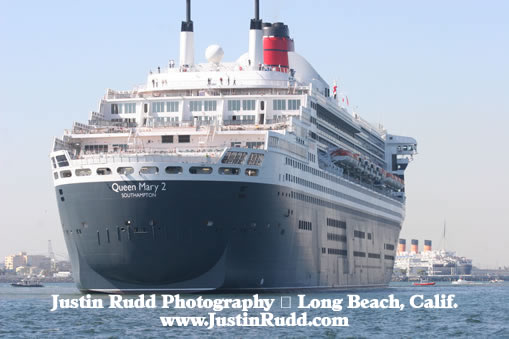 Queen Mary 2 in the foreground welcomes its passengers to Long Beach, California